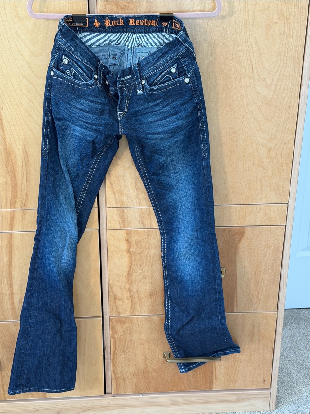 Rock Revival Low Rise Bootcut Jeans with Crystal Fleur de Lis Flap pockets